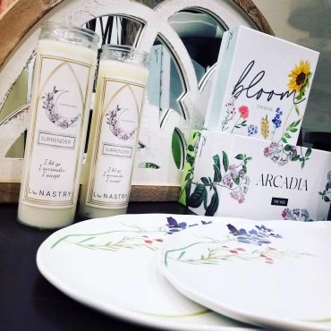 soy candles, decorative plates and vases with floral designs